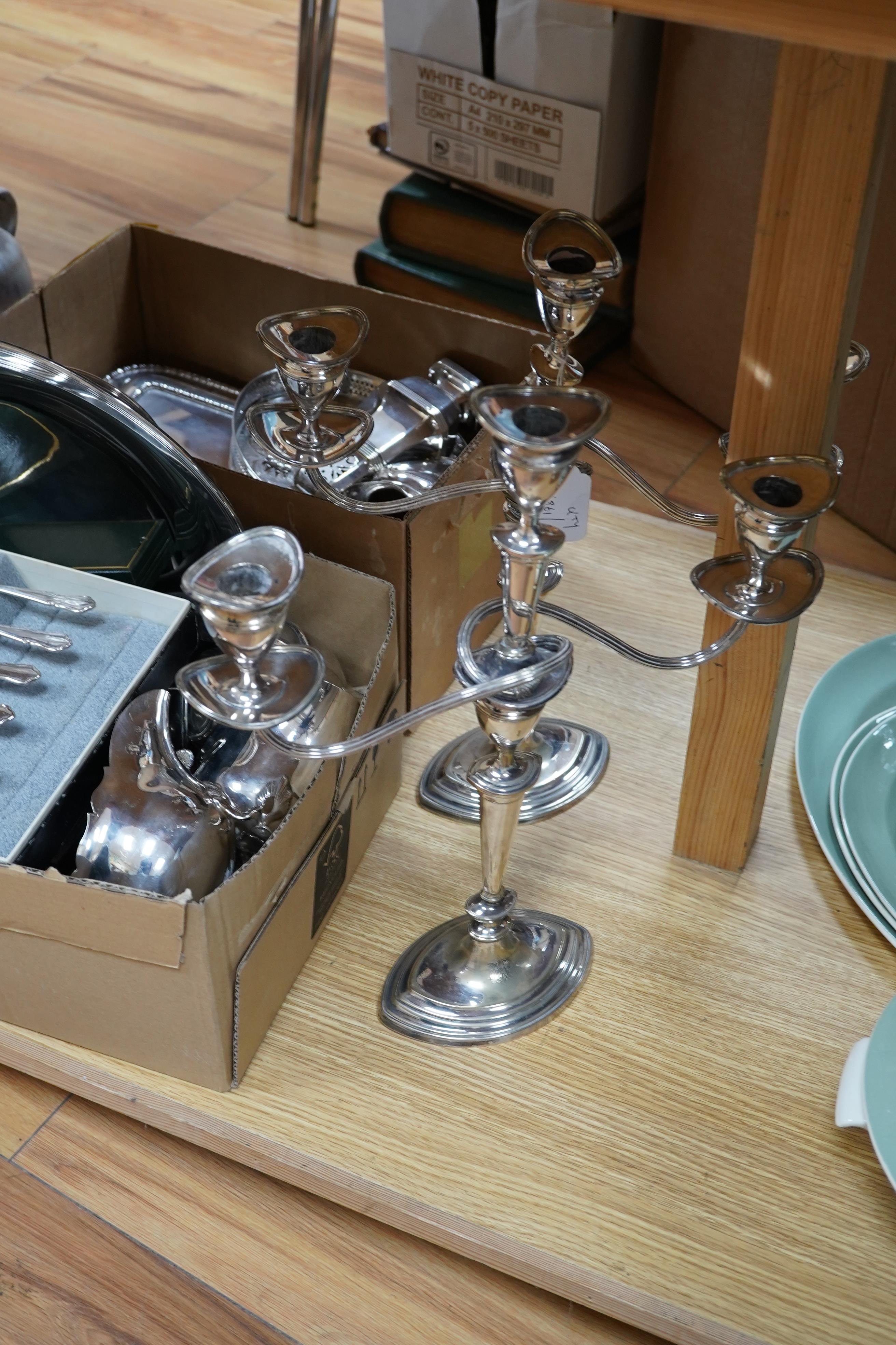 A quantity of assorted plated ware including a pair of three light candelabra - 39cm high. Condition - all fair to good